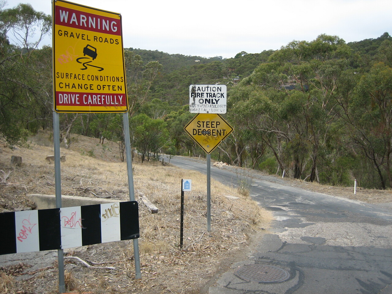 gravel road sign