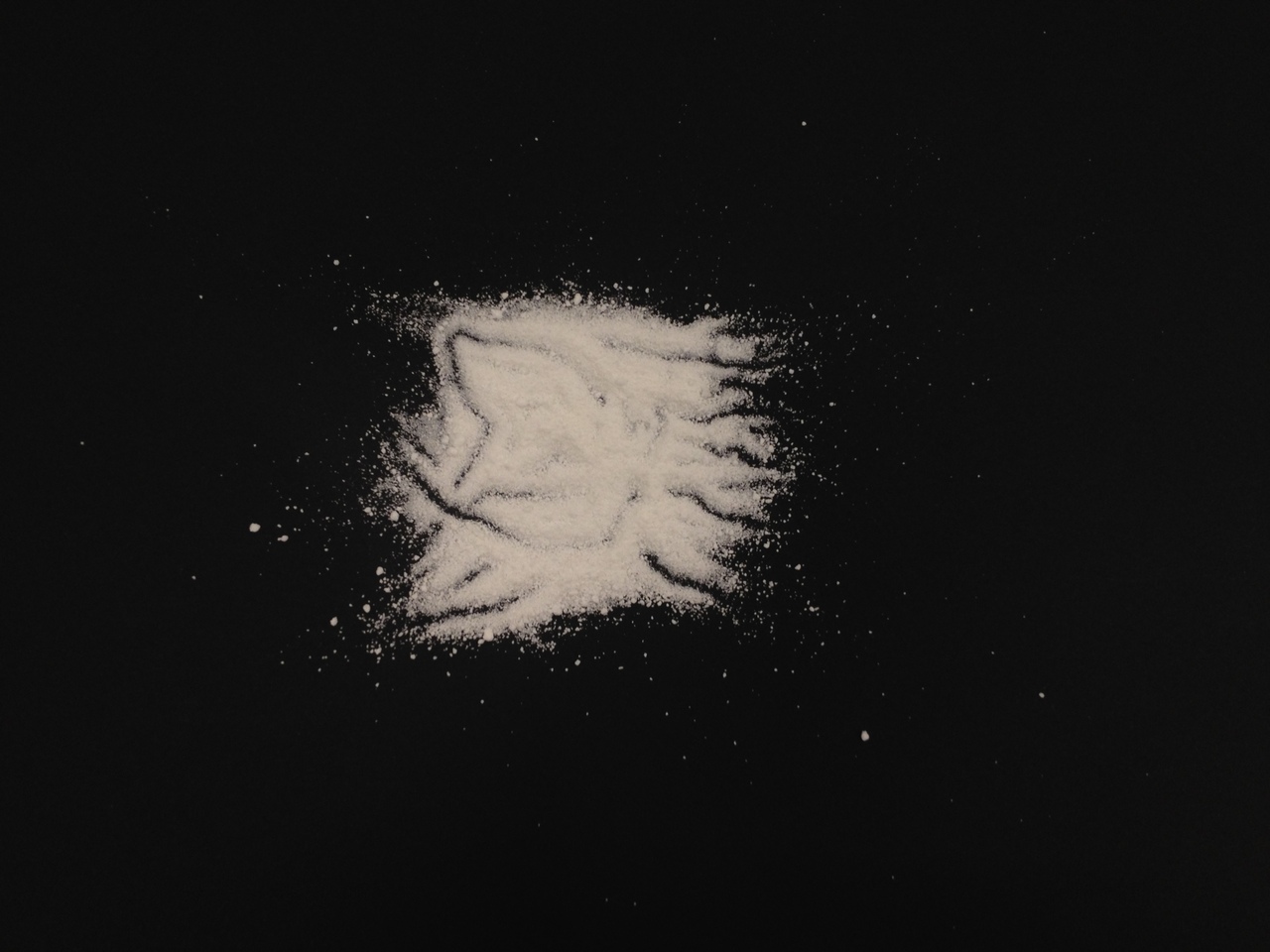 white powder on black