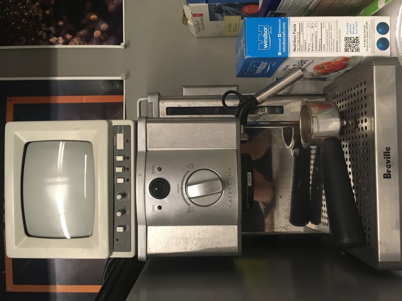 a monitor stacked on an espresso machine